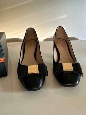 Cole Haan Black Leather Bow Flats with Gold Plaque